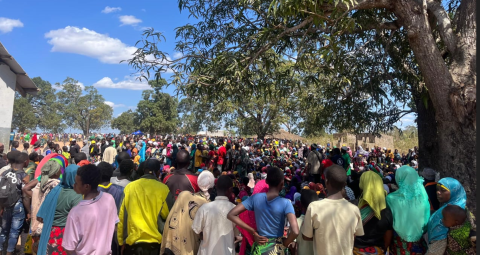 Refugees near a school building in Mozambique.
